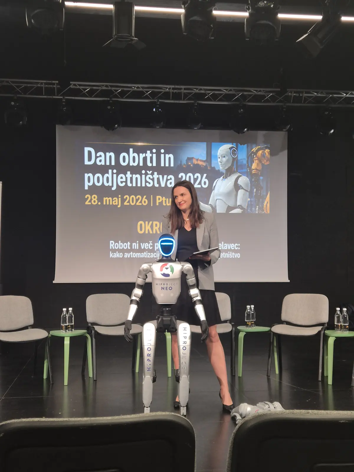Humanoid robot on stage during the event.